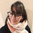 Laura E.